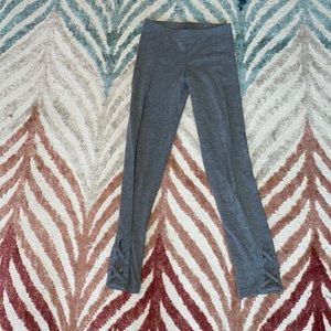 Gray leggings with fancy holes at bottom size medium :8